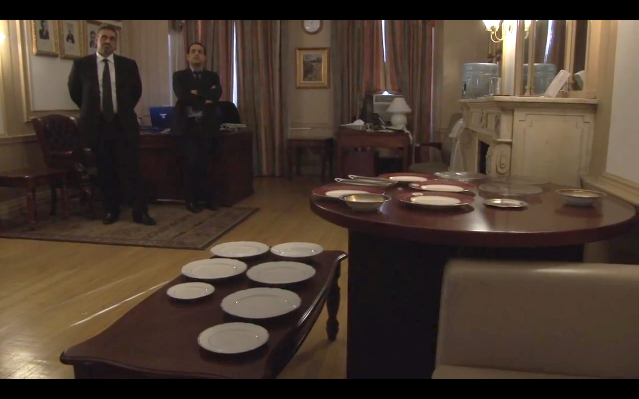 Spoils (video still of Saddam’s dishes being repatriated to Iraq)